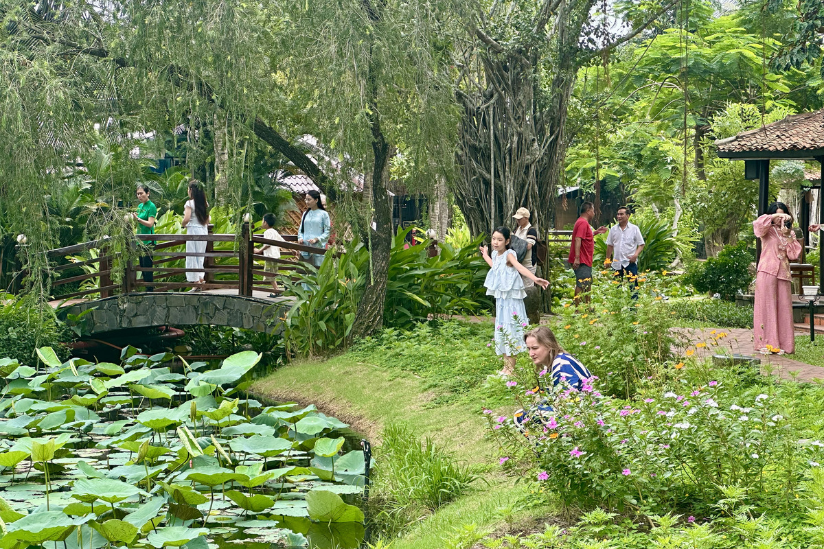 Travelers enjoying a scenic Mekong Delta boat tour from Ho Chi Minh City