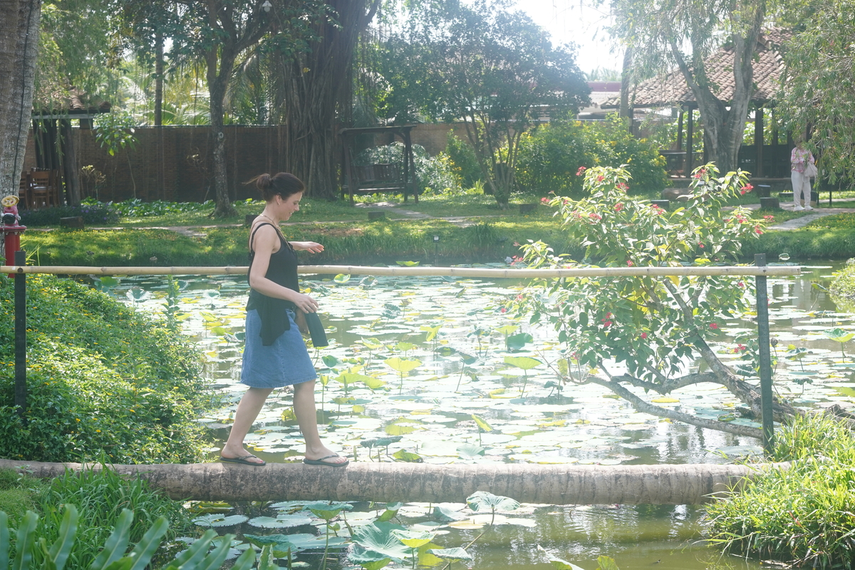 Traveler enjoying a quiet moment by the river in the Mekong Delta