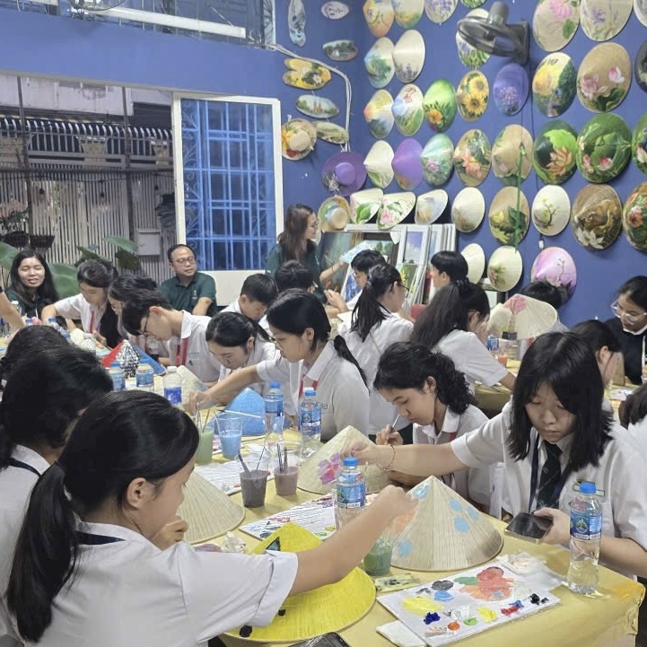 craft workshops for students in Vietnam, including conical hat painting, Vietnamese cultural activities, and creative group experiences in Ho Chi Minh City