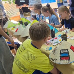 Kids joining a conical hat painting workshop in Vietnam