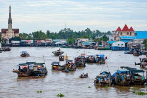 Boats gathering at a floating market on the Mekong Delta during a day tour from Ho Chi Minh City