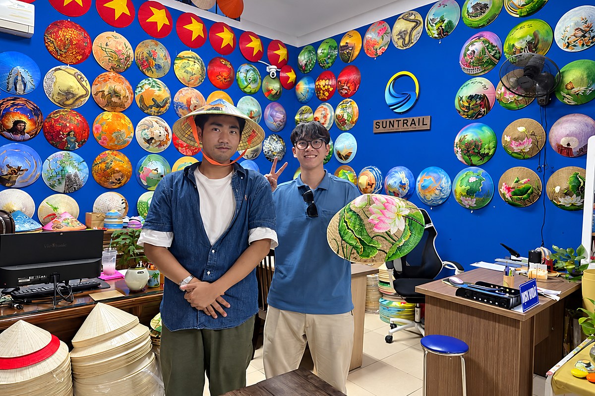 Travelers with conical hats at Suntrail Gallery