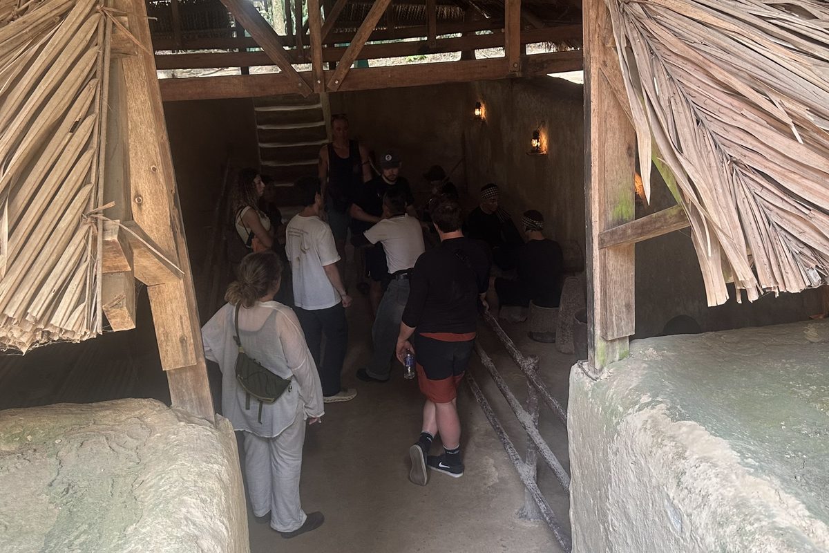 Cu Chi Tunnels distance covered: guests stepping down into an underground shelter